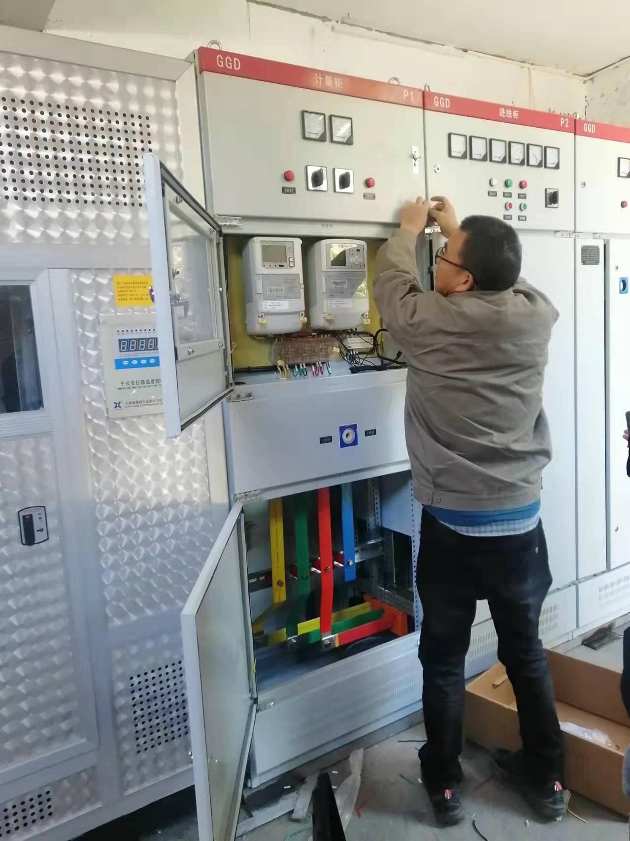 Technician working on GGD distribution panels in a pump factory